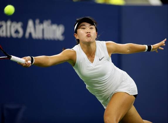 Lin Zhu of China returns the serve to Madison Keys of the USA in the second round match at the 2019 US Open Tennis Championships at the USTA Billie Jean King National Tennis Center on Wednesday, August 28, 2019 in New York City.  NYP20190829331 MONIKAxGRAFF