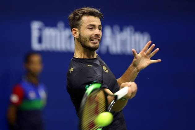 (190829) -- NEW YORK, Aug. 29, 2019 -- Juan Ignacio Londero of Argentina hits a return during the men s singles 2nd round match between Novak Djokovic of Serbia and Juan Ignacio Londero of Argentina at the 2019 US Open in New York, the United States, Aug. 28, 2019. ) (SP)U.S.-NEW YORK-TENNIS-US OPEN-MEN S SINGLES LixMuzi 