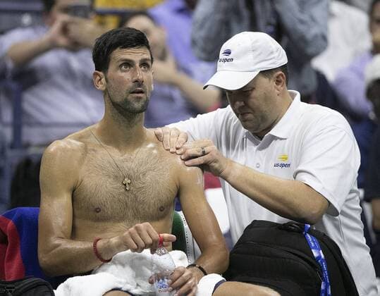 August 28, 2019, Flushig Meadows, New York, United States of America: Novak Djokovic receives treatment on left shoulder during his match against Juan Ignacio Londero on Day 3 of the 2019 US Open at USTA Billie Jean King National Tennis Center on Wednesday August 28, 2019 in the Flushing neighborhood of the Queens borough of New York City. Novak Djokovic defeats Juan Ignacio Londero, 6-4, 7-6(7-3), 6-1. JAVIER ROJAS PI Djokovic defeats Londero - ZUMAp124 20190828_zaa_p124_077 Copyright: xJavierxRojas Pix
