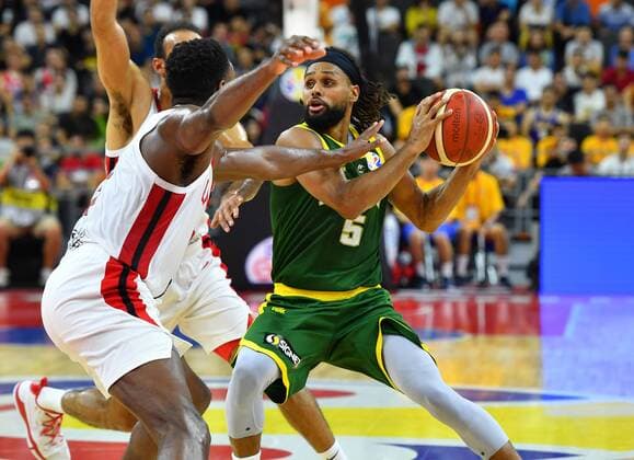(190901) -- DONGGUAN, Sept. 1, 2019 -- Patty Mills (R) of Australia breaks through during the group H match between Australia and Canada at the 2019 FIBA World Cup in Dongguan, south China s Guangdong Province, Sept. 1, 2019. ) (SP)CHINA-DONGGUAN-BASKETBALL WM FIBA WORLD CUP-GROUP H-AUSTRALIA VS CANADA (CN) ZhuxZheng 