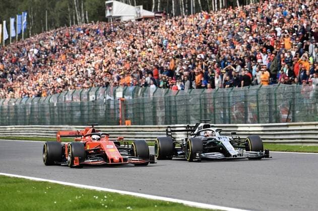 Mercedes British driver Lewis Hamilton passing ahead of Ferrari s German driver Sebastian Vettel during the Spa-Francorchamps Formula One Grand Prix of Belgium race, in Spa-Francorchamps, Sunday 01 September 2019. NICOLASxLAMBERT  x05653644x