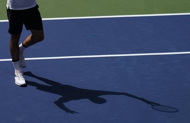Shadow of Roger Federer stretches his arms up and cheers, cheers, joy, emotion, from above Copyright: xJuergenxHasenkopfx