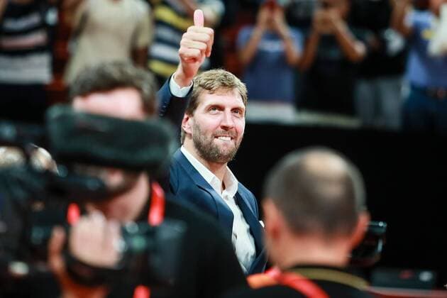 Retired German basketball player Dirk Nowitzki reacts as he watches the first found match of group G between Germany national basketball team and France national basketball team during the 2019 FIBA Basketball World Cup in Shenzhen city, south China s Guangdong province, 1 September 2019. Orlando Magic shooting guard Evan Fournier s super performance helped France beat Germany 78-74 in a Group G encounter at the FIBA basketball World Cup on Sunday (1 September 2019). France edges Germany 78-74 in FIBA basketball World Cup  745612168134787081