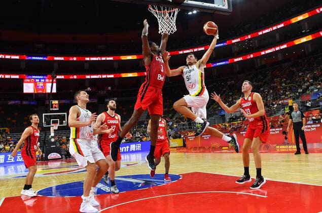 (190903) -- DONGGUAN, Sept. 3, 2019 -- Edgaras Ulanovas (Top R) of Lithuania goes to the basket against Melvin Ejim (Top L) of Canada during the group H match between Lithuania and Canada at the 2019 FIBA World Cup in Dongguan, south China s Guangdong province, Sept. 3, 2019. ) (SP)CHINA-DONGGUAN-BASKETBALL WM FIBA WORLD CUP-GROUP H-LITHUANIA VS CANADA (CN) ZhuxZheng 