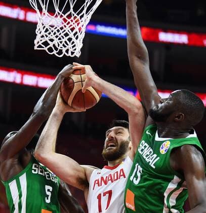 (190905) -- DONGGUAN, Sept. 5, 2019 -- Owen Klassen (C) of Canada goes to the basket as Xane Dalmeida (L) and Youssoupha Ndoye of Senegal defend during the group H match between Senegal and Canada at the 2019 FIBA World Cup in Dongguan, south China s Guangdong Province, Sept. 5, 2019. ) (SP)CHINA-DONGGUAN-BASKETBALL WM FIBA WORLD CUP-GROUP H-SENEGAL VS CANADA (CN) DengxHua 