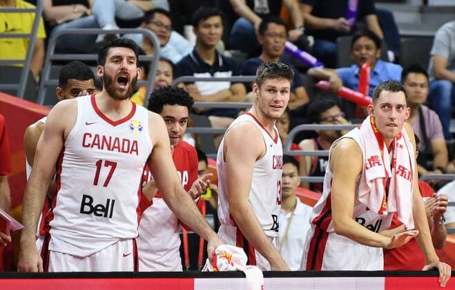 (190905) -- DONGGUAN, Sept. 5, 2019 -- Owen Klassen, Conor Morgan, Kyle Wiltjer (L to R) of Canada celebrate during the group H match between Senegal and Canada at the 2019 FIBA World Cup in Dongguan, south China s Guangdong Province, Sept. 5, 2019. ) (SP)CHINA-DONGGUAN-BASKETBALL WM FIBA WORLD CUP-GROUP H-SENEGAL VS CANADA (CN) DengxHua 