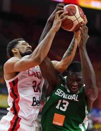 (190905) -- DONGGUAN, Sept. 5, 2019 -- Hamady Ndiaye (R) of Senegal competes with Khem Birch of Canada during the group H match between Senegal and Canada at the 2019 FIBA World Cup in Dongguan, south China s Guangdong Province, Sept. 5, 2019. ) (SP)CHINA-DONGGUAN-BASKETBALL WM FIBA WORLD CUP-GROUP H-SENEGAL VS CANADA (CN) DengxHua 