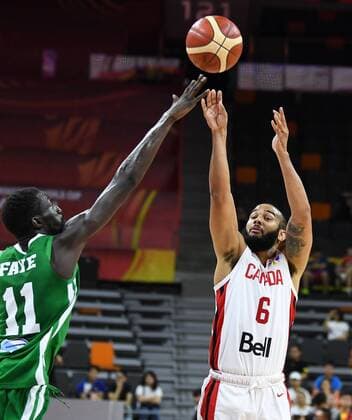 (190905) -- DONGGUAN, Sept. 5, 2019 -- Cory Joseph (R) of Canada shoots the ball during the group H match between Senegal and Canada at the 2019 FIBA World Cup in Dongguan, south China s Guangdong Province, Sept. 5, 2019. ) (SP)CHINA-DONGGUAN-BASKETBALL WM FIBA WORLD CUP-GROUP H-SENEGAL VS CANADA (CN) DengxHua 