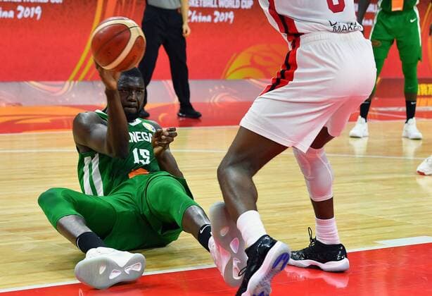 (190905) -- DONGGUAN, Sept. 5, 2019 -- Youssoupha Ndoye (L) of Senegal passes the ball during the group H match between Senegal and Canada at the 2019 FIBA World Cup in Dongguan, south China s Guangdong Province, Sept. 5, 2019. ) (SP)CHINA-DONGGUAN-BASKETBALL WM FIBA WORLD CUP-GROUP H-SENEGAL VS CANADA (CN) ZhuxZheng 