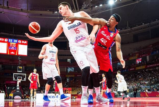 (190906) -- WUHAN, Sept. 6, 2019 -- Alexander Franklin (R) of Puerto Rico competes with Nikola Jokic (Front L) of Serbia during the group J match between Serbia and Puerto Rico at the 2019 FIBA World Cup in Wuhan, capital of central China s Hubei Province, Sept. 6, 2019. ) (SP)CHINA-WUHAN-BASKETBALL-FIBA WORLD CUP-GROUP J-SERBIA VS PUERTO RICO (CN) XiaoxYijiu 