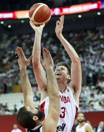 (190907) -- SHANGHAI, Sept. 7, 2019 -- Conor Morgan (R) of Canada shoots during the group P match between Canada and Jordan at the 2019 FIBA World Cup in Shanghai, east China, on Sept. 7, 2019. ) (SP)CHINA-SHANGHAI -BASKETBALL-FIBA WORLD CUP-GROUP P-CANADA VS JORDAN(CN) DingxTing 