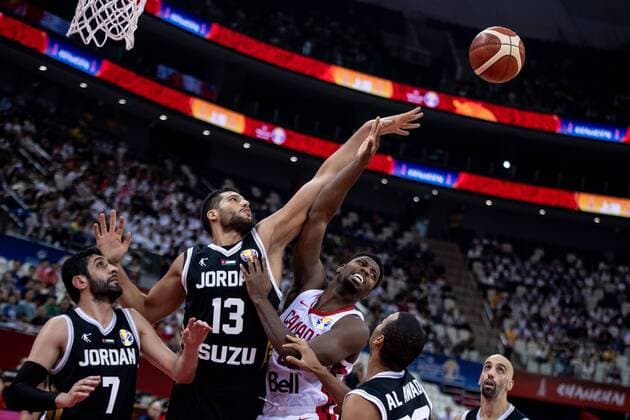 Jordanian professional basketball player Mohammad Hussein, middle, jumps to get the ball at the 17-32 classification round of Group P Canada vs Jordan 2019 FIBA Basketball World Cup in Shanghai, China, 7 September 2019. Canada defeated Jordan at the 17-32 classification round of Group P 2019 FIBA Basketball World Cup 126-71. Canada defeated Jordan at the 17-32 classification round of Group P 2019 FIBA Basketball World Cup  749907350174564490