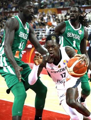 (190907) -- SHANGHAI, Sept. 7, 2019 -- Dennis Schroder (C) of Germany breaks through during the group P match between Germany and Senegal at the 2019 FIBA World Cup in Shanghai, east China, Sept. 7, 2019. ) (SP)CHINA-SHANGHAI -BASKETBALL-FIBA WORLD CUP-GROUP P-GERMANY VS SENEGAL(CN) ChenxFei 