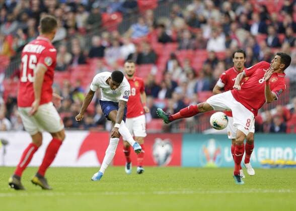7th September 2019; Wembley Stadium, London, England; European Championships 2020 Qualifier, England versus Bulgaria; Marcus Rashford of England taking a shot which is deflected by Georgi Sarmov of Bulgaria - Editorial Use Only.  ActionPlus12165994 JohnxPatrickxFletcher