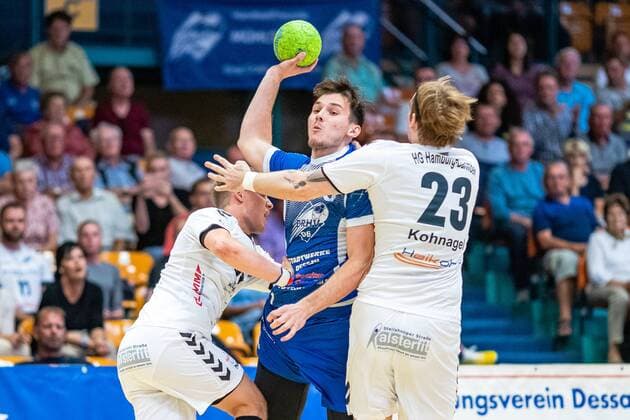Christopher Rix 34 HG Hamburg Barmbek , Timo Löser 5 Dessau Rosslauer HV 06 on the ball, Lasse Kohnagel 23 HG Hamburg Barmbek during the match in the 3 League Handball Mens Season 2019 2020 between Dessau Rosslauer HV 06 and TV 05 07 Hüttenberg in the Anhalt Arena on 8 September 2019 in Dessau Rosslau, Saxony Anhalt, Germany