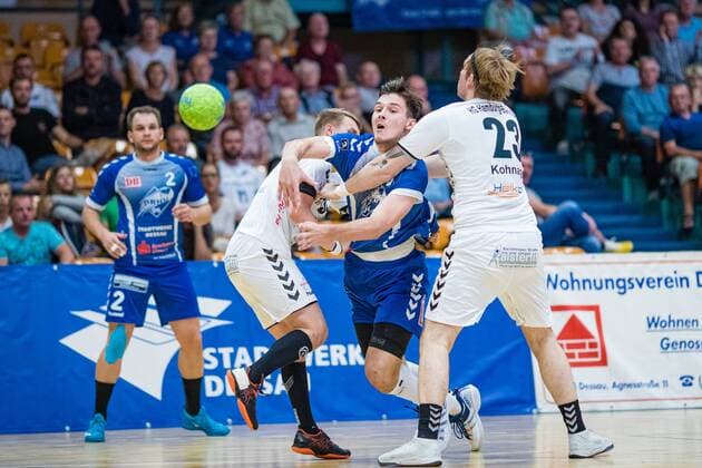 Christopher Rix 34 HG Hamburg Barmbek , Timo Löser 5 Dessau Rosslauer HV 06 on the ball, Lasse Kohnagel 23 HG Hamburg Barmbek during the match in the 3 League Handball Mens Season 2019 2020 between Dessau Rosslauer HV 06 and TV 05 07 Hüttenberg in the Anhalt Arena on 8 September 2019 in Dessau Rosslau, Saxony Anhalt, Germany