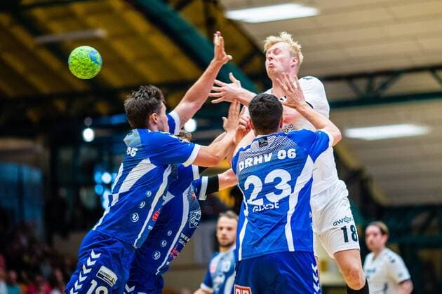 Michael Knitrup 18 HG Hamburg Barmbek with ball loss and Lennert Gliese 23 Dessau Rosslauer HV 06 , Daniel Schmidt 19 Dessau Rosslauer HV 06 during the match in the 3 League Handball Mens Season 2019 2020 between Dessau Rosslauer HV 06 and TV 05 07 Hüttenberg in the Anhalt Arena on 8 September 2019 in Dessau Rosslau, Saxony Anhalt, Germany