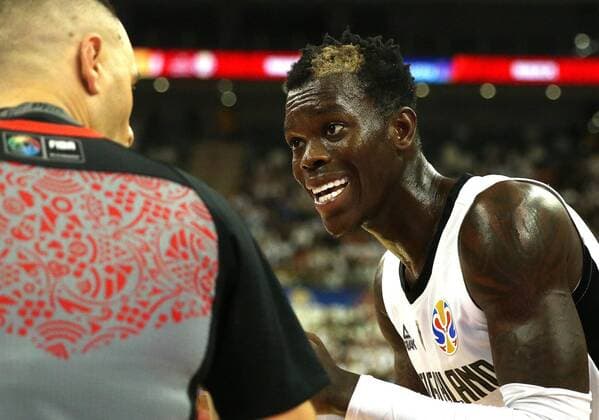 (190909) -- SHANGHAI, Sept. 9, 2019 -- Dennis Schroder (R) of Germany talks to the referee during the Group P match between Germany and Canada at the 2019 FIBA World Cup in Shanghai, east China, Sept. 9, 2019. ) (SP)CHINA-SHANGHAI-BASKETBALL-FIBA WORLD CUP-GROUP P-GER VS CAN(CN) ChenxFei 