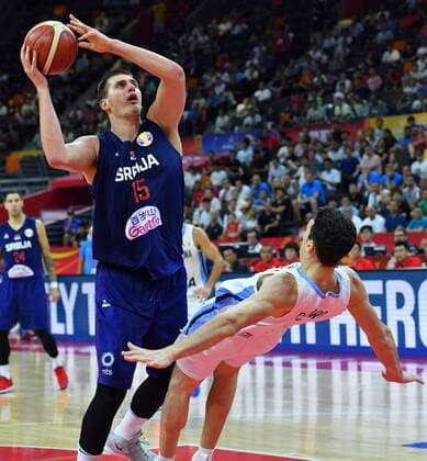 (190910) -- DONGGUAN, Sept. 10, 2019 -- Nikola Jokic (L) of Serbia goes up for a basket against Agustin Caffaro of Argentina during the quarter-final match between Argentina and Serbia at the 2019 FIBA World Cup in Dongguan, south China s Guangdong Province, Sept. 10, 2019. ) (SP)CHINA-DONGGUAN-BASKETBALL-FIBA WORLD CUP-QUARTER FINAL-ARGENTINA VS SERBIA (CN) ZhuxZheng 