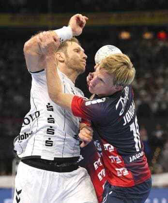 Photo left Steffen Weinhold against Magnus Jondal Flensburg Handball Men 1 Bundesliga at Do 12 09 2019 THW Kiel SG Flensburg 28 24
