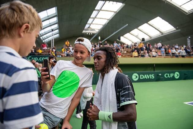 2019 Davis Cup Sweden v Israel 190914 Mikael Ymer of Sweden takes a selfie with a spectator after the Davis Cup qualification tennis match between Sweden and Israel on September 14, 2019 in Stockholm,  Copyright: JOHANNAxLUNDBERG BB190914JL007
