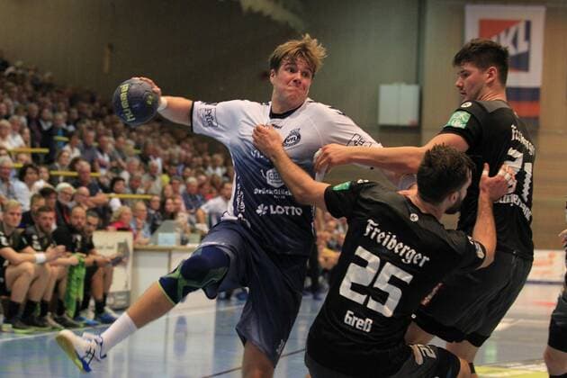 2 Bundesliga Handball VfL Luebeck Schwartau HC Elbflorenz 2006 14 09 2019, Hansehalle Luebeck, GER, VfL Luebeck Schwartau HC Elbflorenz 2006 picture shows Dadi Runarsson VfL Luebeck Schwartau in duel against Sebastian Greß Gress HC Elbflorenz 2006 and Philip Jungemann HC Elbflorenz 2006 nordphotox xTauchnitz nph00059