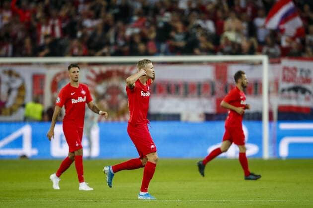SOCCER - CL, RBS vs Genk SALZBURG,AUSTRIA,17.SEP.19 - SOCCER - UEFA Champions League, group stage, Red Bull Salzburg vs KRC Genk. Image shows the rejoicing of Dominik Szoboszlai (RBS), Erling Haaland (RBS) and Andreas Ulmer (RBS). GEPAxpictures xJasminxWalter