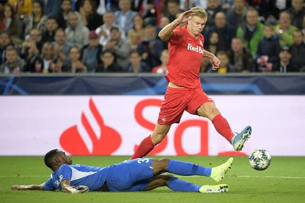 Genk s Jhon Lucumi Bonilla and Salzburg s Erling Braut Haland fight for the ball during a game between Austrian club RB Salzburg and Belgian RC Genk, Tuesday 17 September 2019 in Salzburg, Austria, first match in the group stage of the UEFA Champions League. YORICKxJANSENS  x05665912x