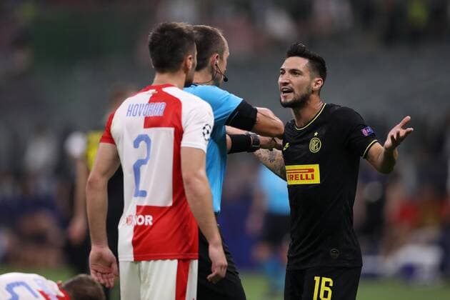 Matteo Politano of Inter is booked by the referee Ruddy Buquet during the UEFA Champions League match at the San Siro, Milan. Picture date: 17th September 2019. Picture credit should read: Jonathan Moscrop Sportimage EDITORIAL USE ONLY. No use with unauthorised audio, video, data, fixture lists, club league logos or live services. Online in-match use limited to 120 images, no video emulation. No use in betting, games or single club league player publications. SPI-0207-0032