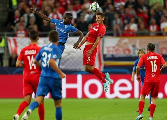 SOCCER - CL, RBS vs Genk SALZBURG,AUSTRIA,17.SEP.19 - SOCCER - UEFA Champions League, group stage, Red Bull Salzburg vs KRC Genk. Image shows Jakub Piotrowski (Genk) and Maximilian Wöber (RBS). GEPAxpictures xPatrickxSteiner