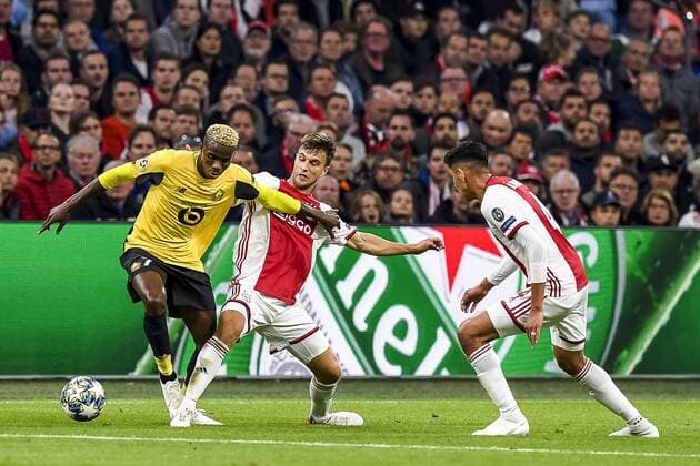 AMSTERDAM, 17-09-2019 JohanCruyff Arena , Champions League Football season 2019 2020 . Lille player Victor Osimhen, Ajax player Joel Veltman celebrating the goal during the match Ajax - Lille. Ajax - Lille  x4498675x Copyright: