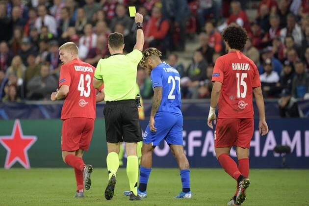 Genk s Theo Bongonda receives a yellow card from referee Felix Zwayer during a game between Austrian club RB Salzburg and Belgian RC Genk, Tuesday 17 September 2019 in Salzburg, Austria, first match in the group stage of the UEFA Champions League. YORICKxJANSENS  x05666027x