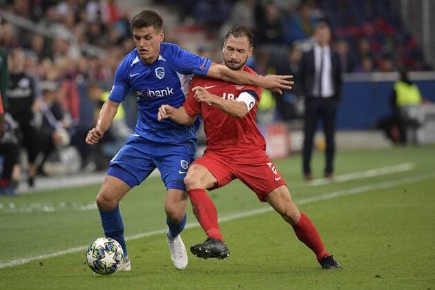 Genk s Joakim Maehle Pedersen and Salzburg s Andreas Ulmer fight for the ball during a game between Austrian club RB Salzburg and Belgian RC Genk, Tuesday 17 September 2019 in Salzburg, Austria, first match in the group stage of the UEFA Champions League. YORICKxJANSENS  x05666041x