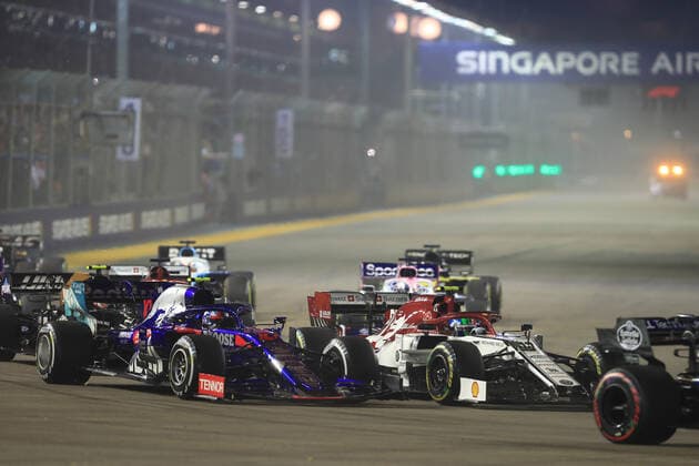 22nd September 2019; The Marina Bay Circuit, Marina Bay, Singapore; Formula One, Race Day; Alfa Romeo Racing, Antonio Giovinazzi and Scuderia Toro Rosso, Pierre Gasly battle into turn 1  ActionPlus12170266 Octane