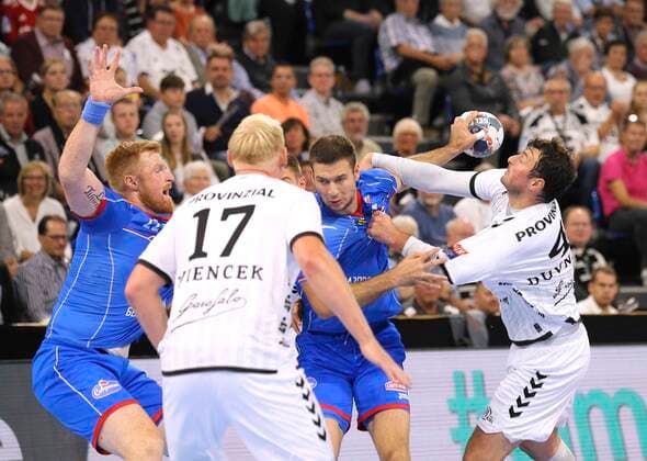 Photo Scored by Marko Panic Meshkov, blue against Domagoj Duvnjak Handball Men Champions League at Mi 25 09 2019 THW Kiel HC Meshkov Brest