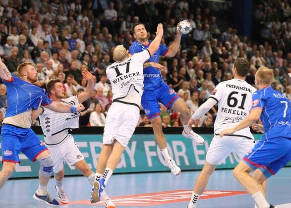 Photo Scored by Marko Panic against Patrick Wiencek Kiel Handball Men Champions League at Mi 25 09 2019 THW Kiel HC Meshkov Brest