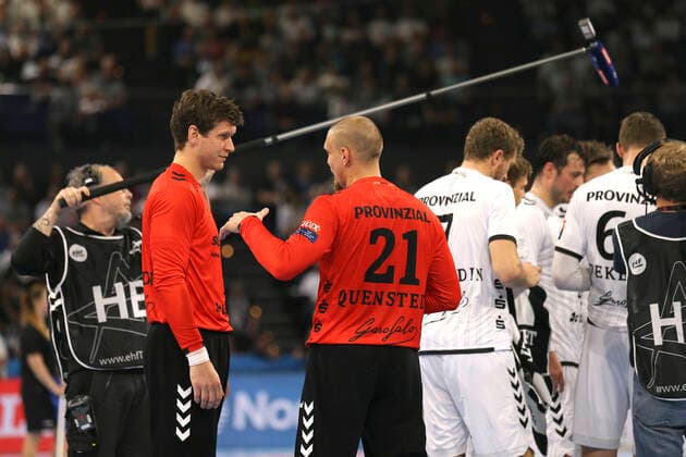 the goalkeepers in conversation , left Niklas Landin , middle Dario Quenstedt