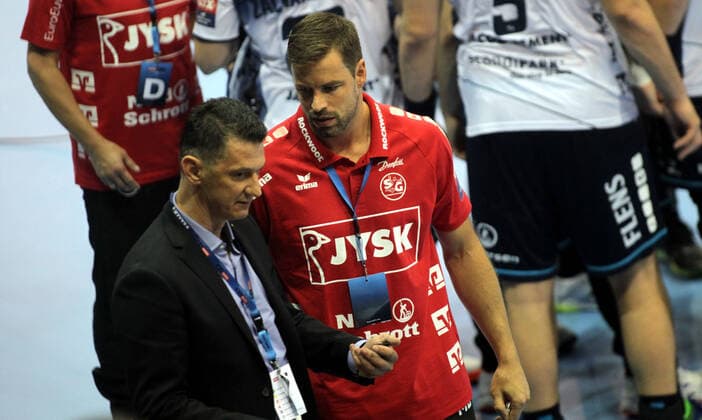 28.09.2019 Szeged(Hungary) MOL Pick Szeged-SG Flensburg-Handewitt EHF Champions League men s handball Mark Bult(C)SG Flensburg-Handewitt assistant coach react at decision of Slovakian referee for time out to EHF delegate Predrag Pavicevic(L) Montenegro : 