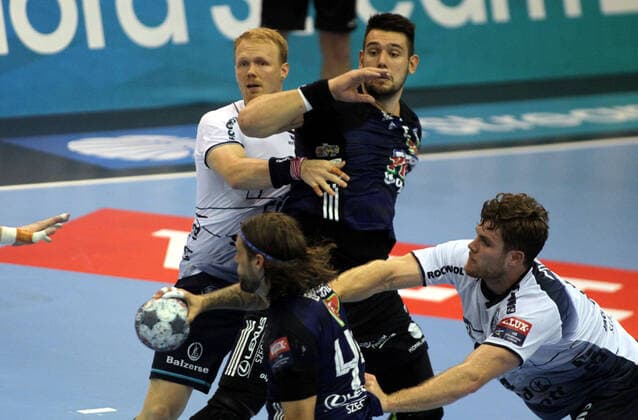 28.09.2019 Szeged(Hungary) MOL Pick Szeged-SG Flensburg-Handewitt EHF Champions League men s handball Anders Zachariassen(L),Johannes Golla(L) SG Flensburg-Handewitt stopped Bence Banhidi(C)MOL Pick Szeged : 