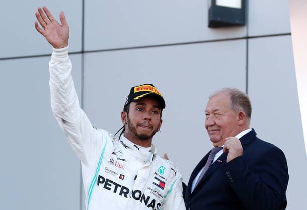 SOCHI, RUSSIA â€“ SEPTEMBER 29, 2019: Mercedes AMG Petronas driver Lewis Hamilton (L) of the United Kingdom, first-placed, and Viktor Kiryanov, infrastructure projects managing director at the Rostec State Corporation, during the 2019 Formula One Russian Grand Prix victory ceremony at the Sochi Autodrom racing circuit. Sergei Fadeichev TASS  TS0BCCCB