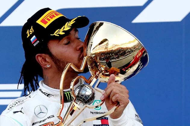SOCHI, RUSSIA â€“ SEPTEMBER 29, 2019: Mercedes AMG Petronas F1 driver Lewis Hamilton of the United Kingdom, first-placed, kisses the trophy during the 2019 Formula One Russian Grand Prix victory ceremony at the Sochi Autodrom racing circuit. Sergei Fadeichev TASS  TS0BCCE2