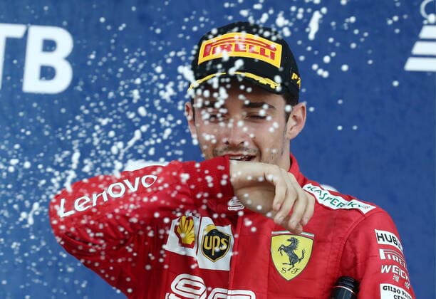 SOCHI, RUSSIA â€“ SEPTEMBER 29, 2019: Third-placed Scuderia Ferrari F1 driver Charles Leclerc of Monaco sprays champagne on the podium during the 2019 Formula One Russian Grand Prix victory ceremony at the Sochi Autodrom racing circuit. Sergei Fadeichev TASS  TS0BCD04