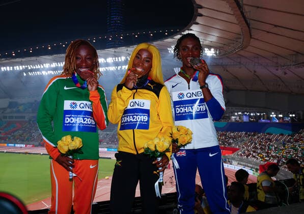 (191001) -- DOHA, Oct. 1, 2019 -- Shelly-Ann Fraser-Pryce (C) of Jamaica, Dina Asher-Smith (R) of Britain and Marie-Josee Ta Lou of Cote d Ivoire pose for photos during the awarding ceremony of the women s 100m final at the 2019 IAAF World Athletics Championships in Doha, Qatar, Sept. 30, 2019. ) (SP)QATAR-DOHA-IAAF WORLD ATHLETICS CHAMPIONSHIPS-WOMEN S 100M-AWARDING CEREMONY WangxJingqiang 
