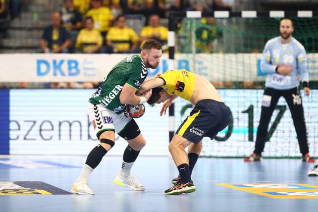 Jacob Bagersted Goeppingen pulls Niclas Kirkelokke Rhein Neckar Loewen almost the jersey from Rhein Neckar Loewen vs Frischauf Goeppingen, Handball, DHB Pokal, 02 10 2019 Rhein Neckar Loewen vs Frischauf Goeppingen, Handball, DHB Pokal, 02 10 2019 Mannheim, Germany Copyright: xEIBNER RenexWeissx EP_RWS