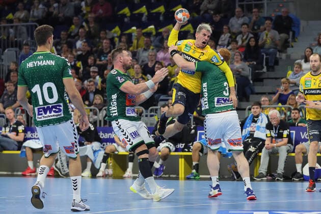 Rhein Neckar Loewen vs Frisch Auf Goeppingen Mannheim, Germany 02 October 2019 DHB Cup Round of 16th Finals in the SAP Arena v left in the duel Jacob Bagersted Goeppingen , Andy Schmid Loewen and Nicolai Theilinger Goeppingen
