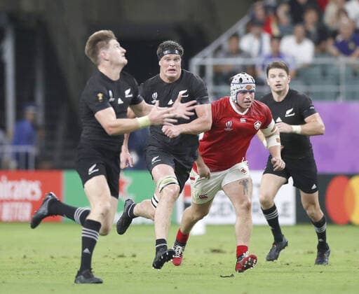 Rugby World Cup: New Zealand v Canada New Zealand winger Jordie Barrett (L) on the charge against Canada along with his brothers Scott (C) and Beauden (far R) in a Rugby World Cup game in Oita, Japan, on Oct. 2, 2019. 