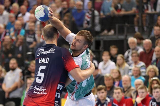 SG Flensburg Handewitt vs. TSV Hannover Burgdorf, DHB Cup Round of 16, Flensburg 03 10 19 Fabian Boehm TSV Hannover Burgdorf, 20 against Simon Hald SG Flensburg Handewitt, 05 Copyright: xBEAUTIFULxSPORTS MarioxM.xKobergx