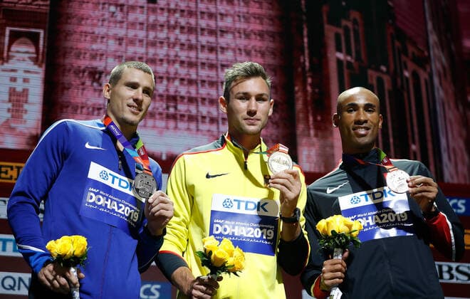 (191005) -- DOHA, Oct. 5, 2019 -- Gold medalist Niklas Kaul (C) of Germany, silver medalist Maicel Uibo (L) of Estonia and bronze medalist Damian Warner of Canada pose during the medal ceremony for the Men s Decathlon at the 2019 IAAF World Athletics Championships in Doha, Qatar, Oct. 4, 2019. ) (SP)QATAR-DOHA-ATHLETICS-IAAF WORLD CHAMPIONSHIPS WangxLili 