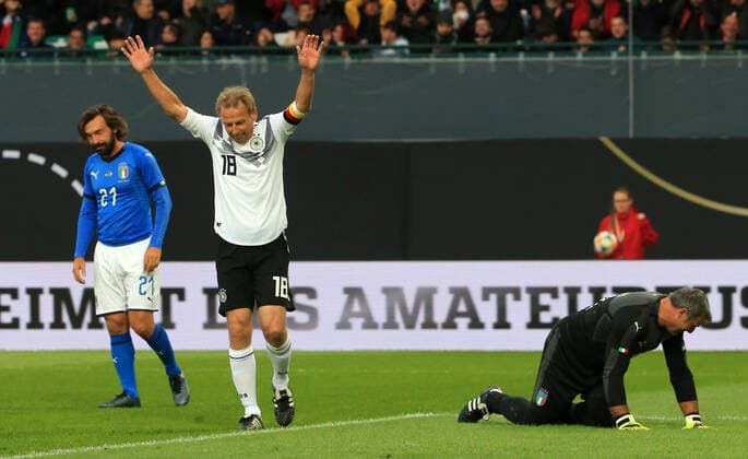 07 10 2019, DFB All Stars vs. Azzuri Legends, Sportpark Ronhof Fuerth, football, sport, in picture Andrea Pirlo Azzuri All Stars , Juergen Klinsmann DFB All Stars cheers for the 2 0, Angelo Peruzzi Azzuri All Stars on the floor