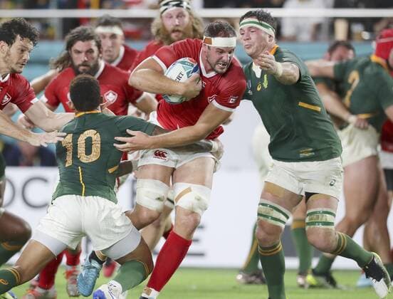 Rugby World Cup in Japan: S. Africa v Canada Tyler Ardron (C) of Canada is tackled by Elton Jantjies (10) of South Africa during the first half of a Rugby World Cup Pool B match on Oct. 8, 2019, in Kobe, western Japan. 
